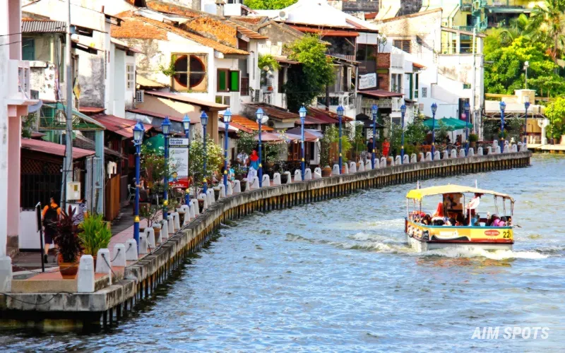 Malacca River cruise boats at night with colorful lights
