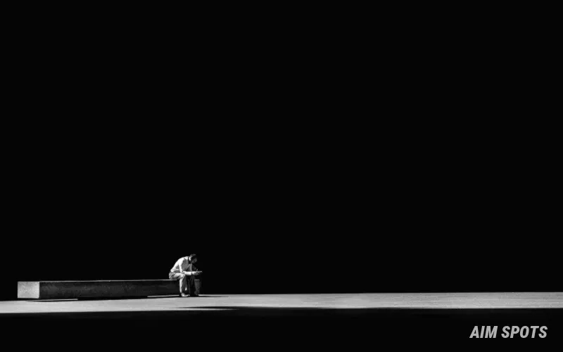 person sitting peacefully on a beach without technology