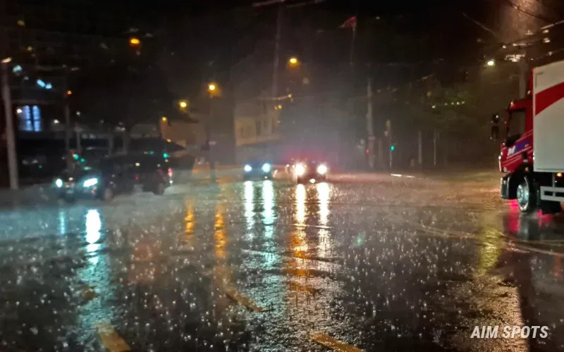 heavy rain on highway windshield