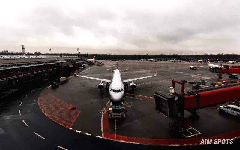 Busy airport terminal with departures board